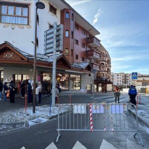A street scene at a Swiss ski resort village with chalet-style buildings