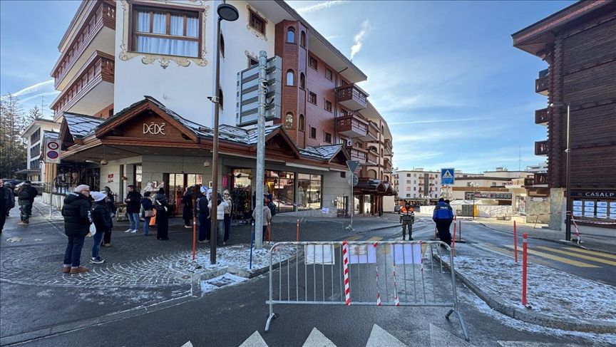 A street scene at a Swiss ski resort village with chalet-style buildings